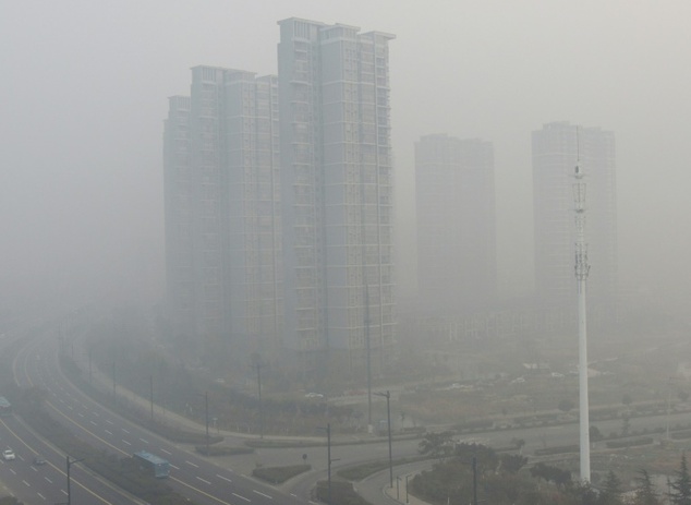 Residential blocks are seen covered in smog in Lianyungang, east China